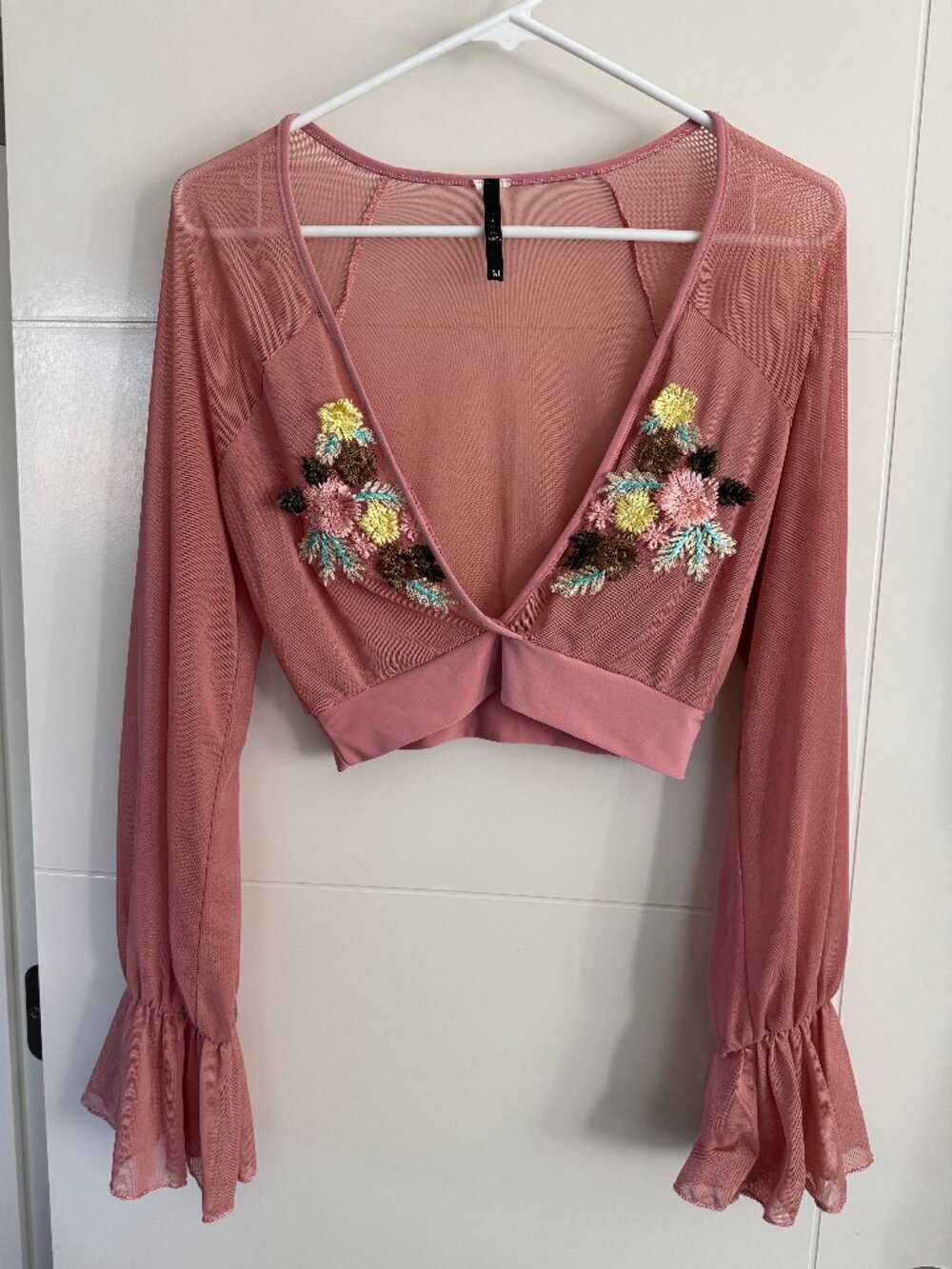 Chemise crop top with features delicate floral embroidery long bell sleeves